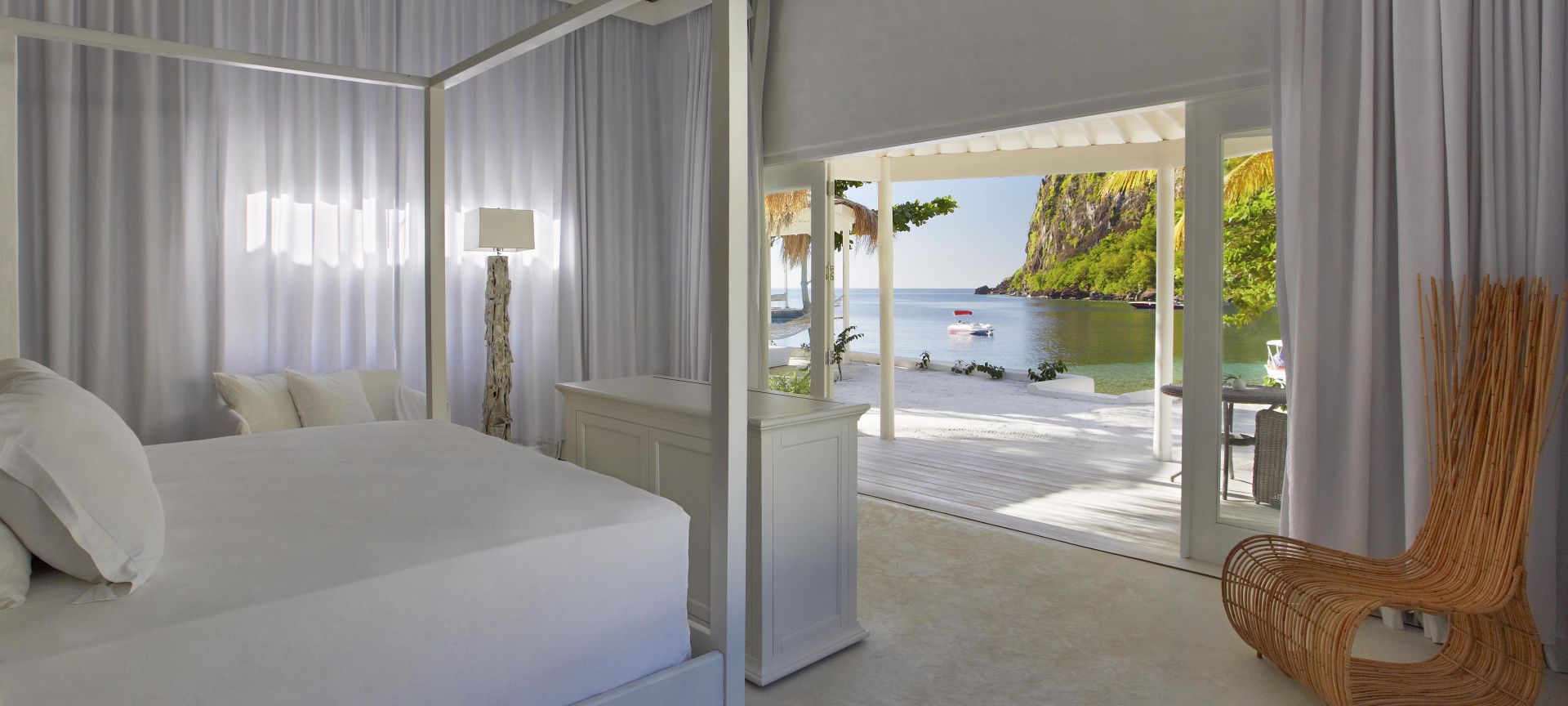 A Bedroom With A Large Bed In A Room