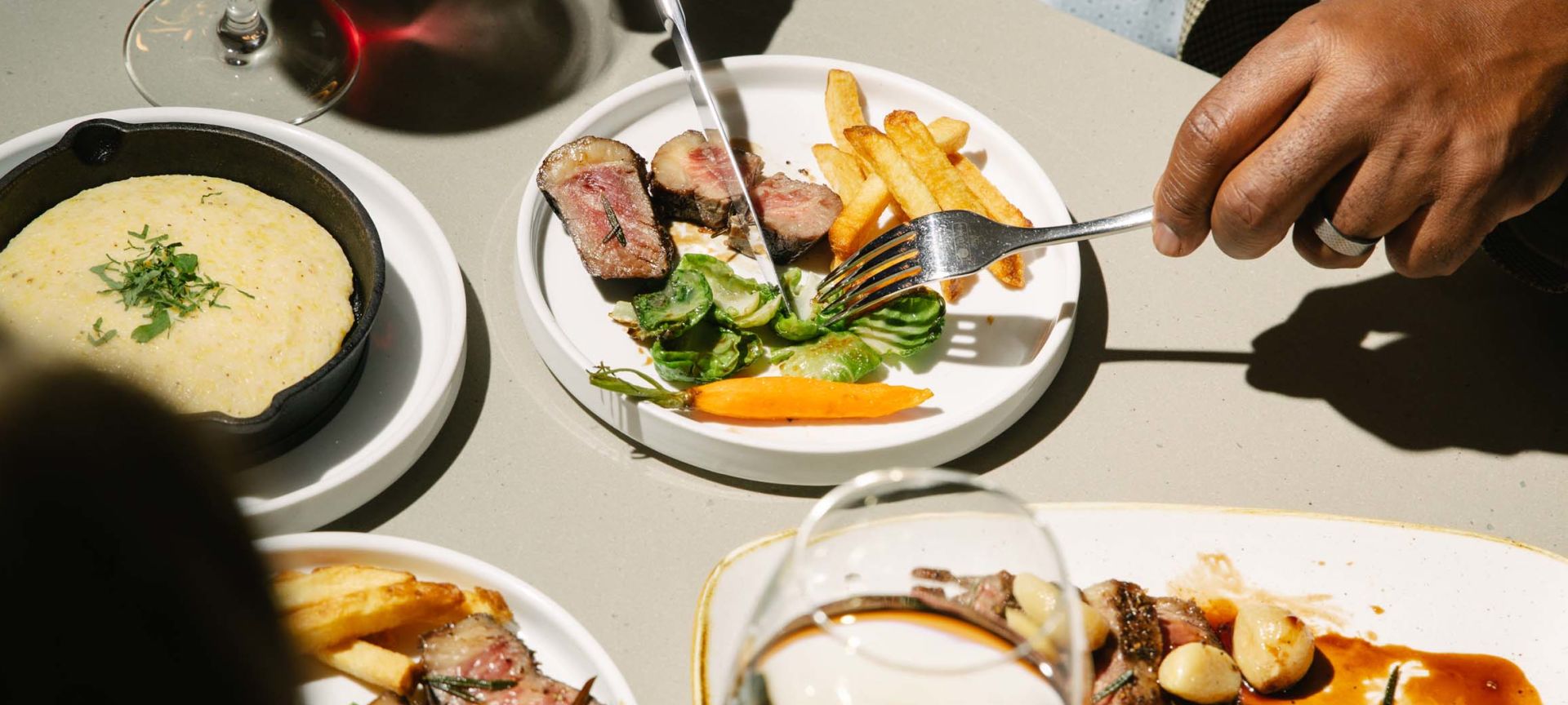 A Person Eating Food At A Table