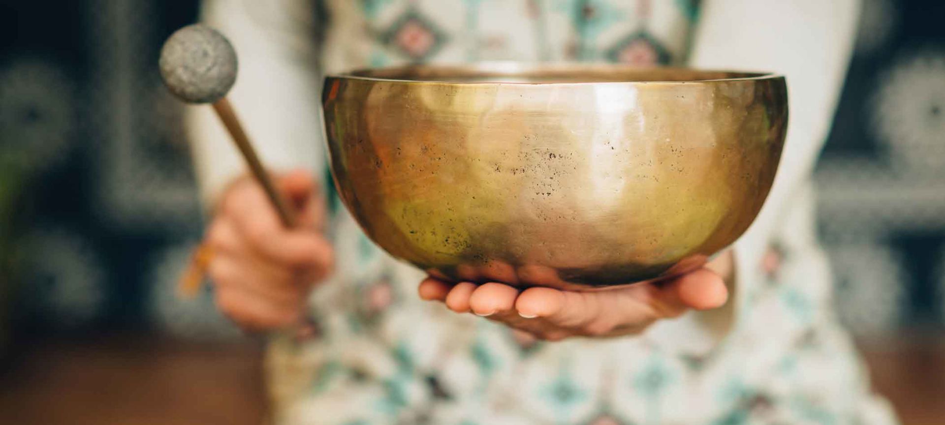 A Person Holding A Bowl Over Their Head