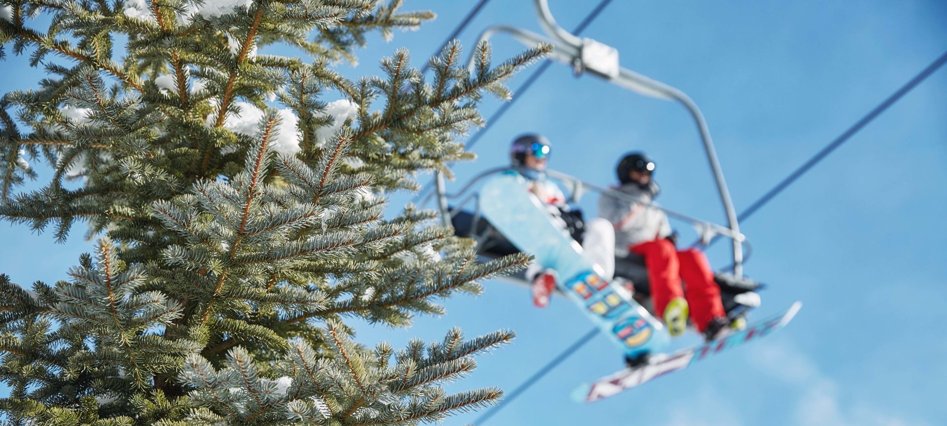 A Person Flying Through The Air While Riding Skis