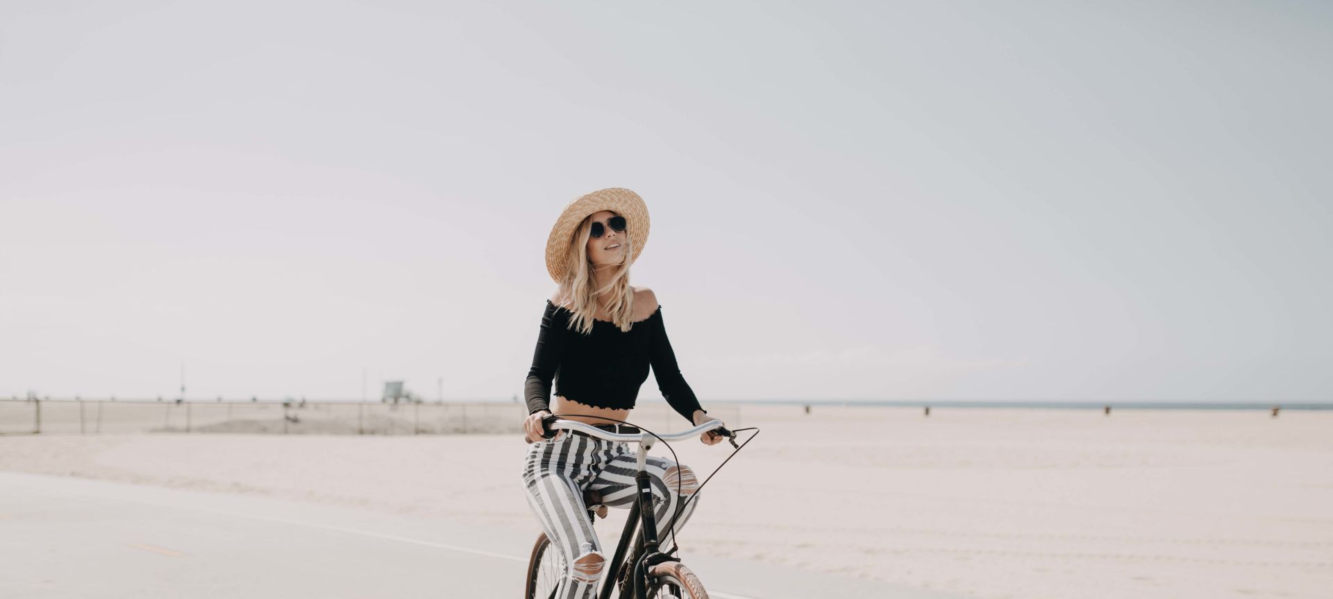 Woman enjoy a bike ride in Santa Monica beach