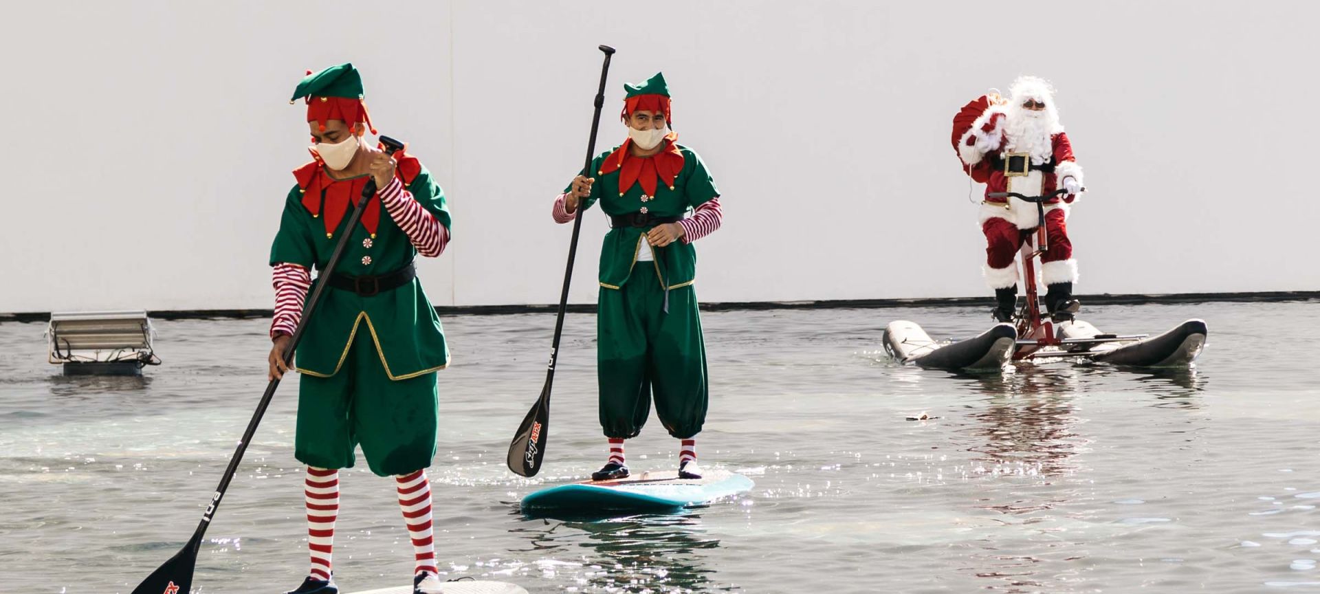Santa and Elves on a Paddleboard