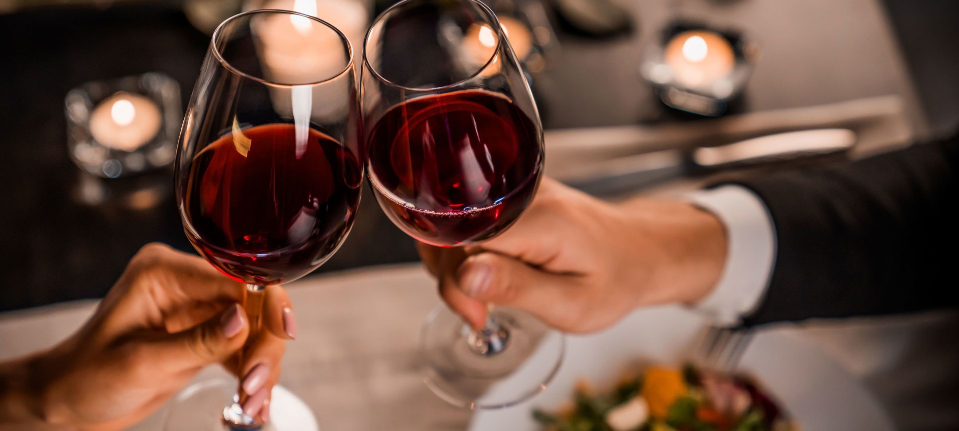 Couple At Dinner With Glasses of Wine