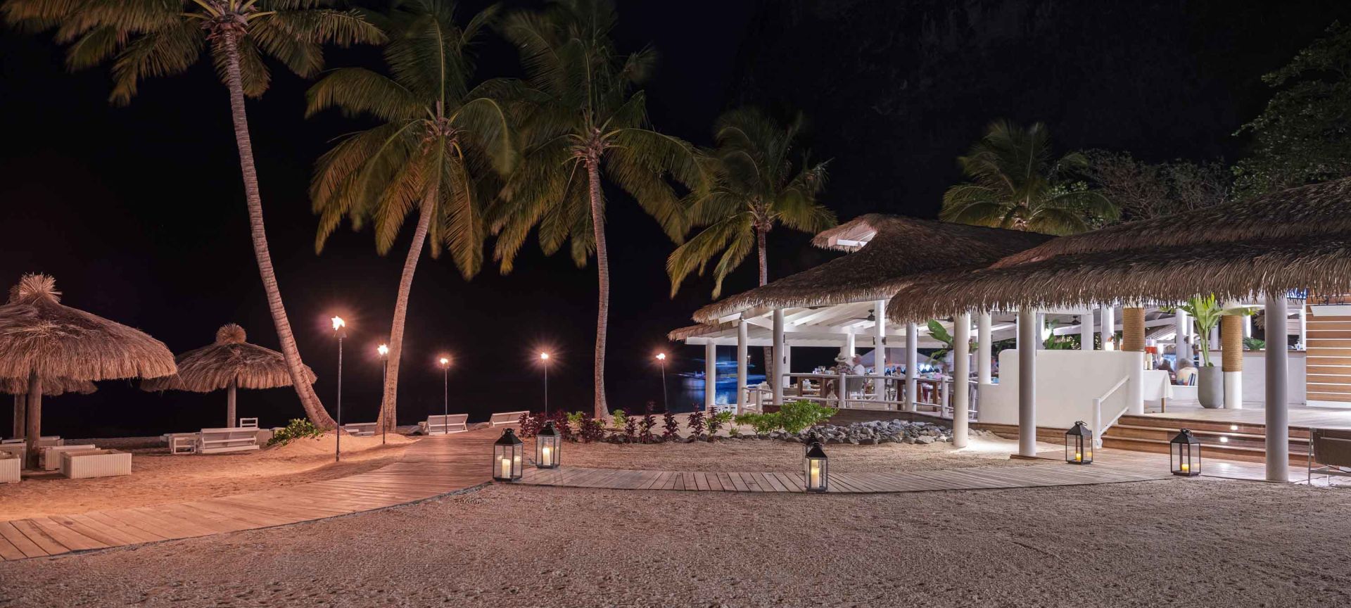 A Restaurant on the Beach at Nighttime