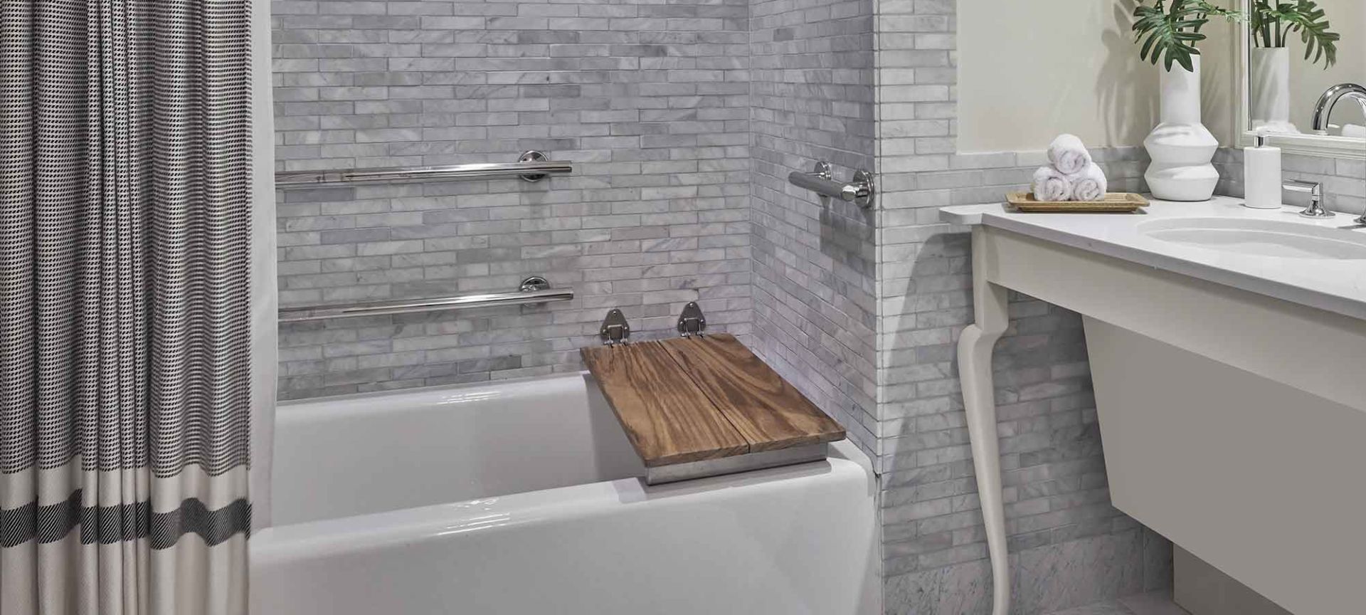 A Bathroom With A Tub And Sink